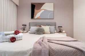 1 bedroom, desk, iron/ironing board, travel crib