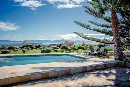 Outdoor pool, pool umbrellas, sun loungers