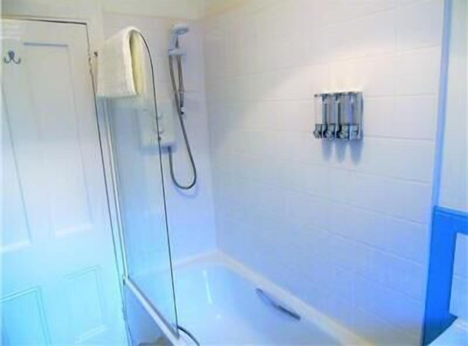 Bathtub, hair dryer, towels