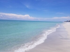 A beach with clear turquoise water and a sandy shore. - Best views of the beach from your balcony Unit 301 (Longboat Key)