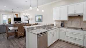 Enjoy meals in the spacious kitchen with a central island, double sink, and ample counter space.