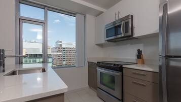 Luxury Apartment, 1 Bedroom | Private kitchen | Fridge, microwave, oven, stovetop