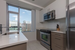 Luxury Apartment, 1 Bedroom | Private kitchen | Fridge, microwave, oven, stovetop