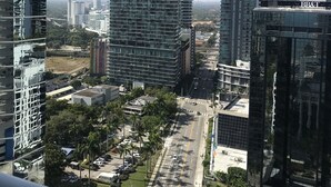 A high-rise building with a modern glass facade, surrounded by other tall buildings and a clear sky. - Stay at Brickell by Executive Corporate Rental (Miami)