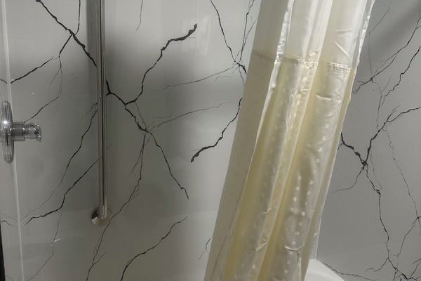Standard Double Room, 2 Queen Beds | Bathroom | Combined shower/tub, deep soaking tub, free toiletries, hair dryer