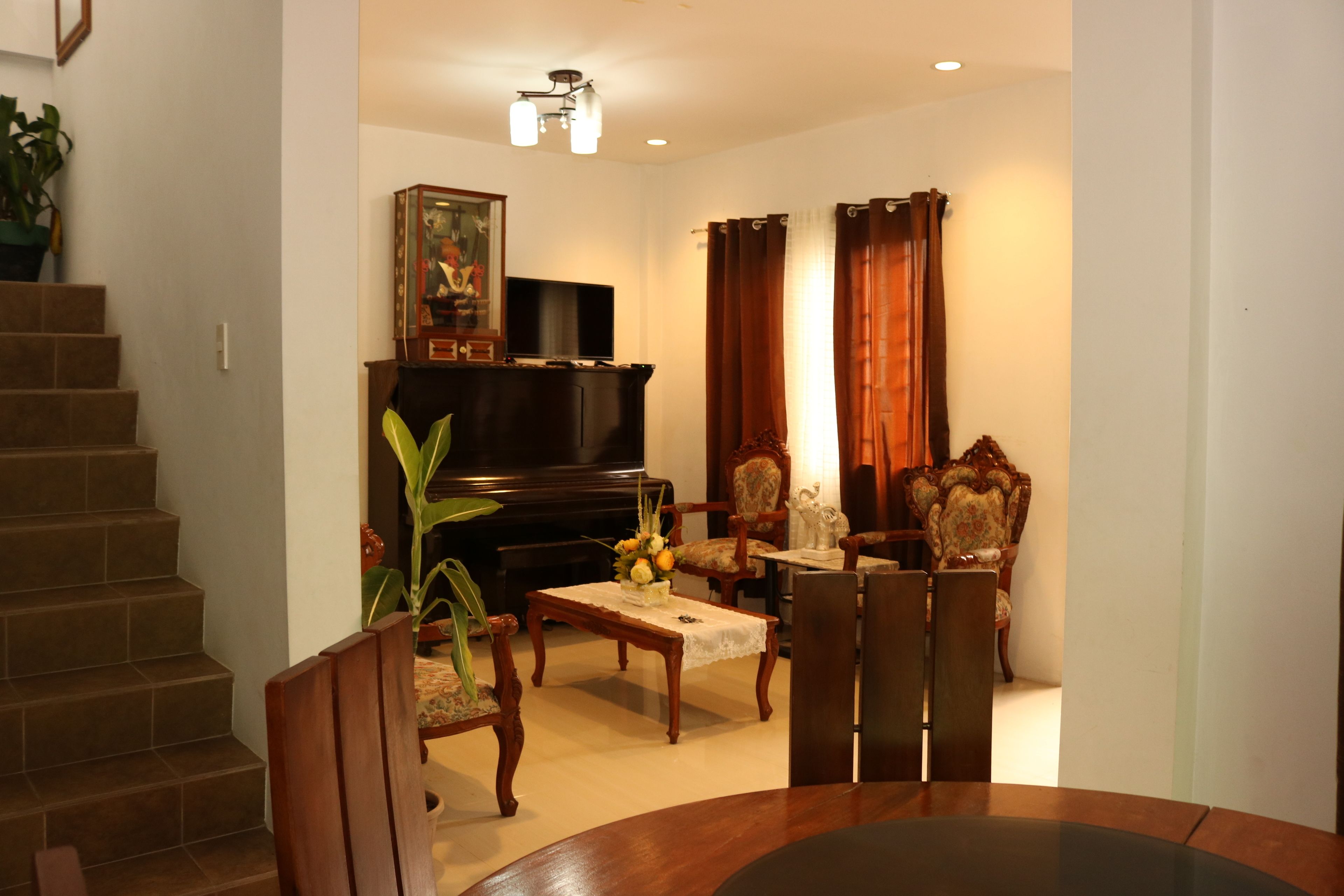 Basic House, 4 Bedrooms | Living area | Flat-screen TV