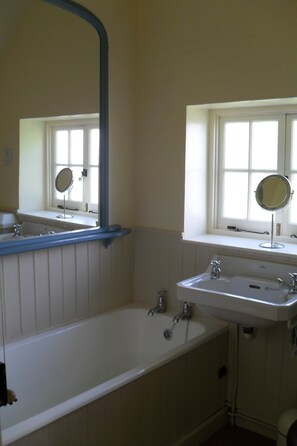 Bathtub, hair dryer, towels, soap