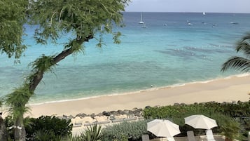 On the beach, sun loungers, beach towels