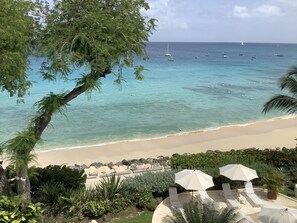 On the beach, sun-loungers, beach towels - **Luxury 4Bed/4Bath Beachfront Villa – Panoramic Ocean Views, Prime Location** (Holetown)