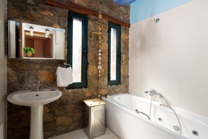 Bathtub, eco-friendly toiletries, hair dryer, towels