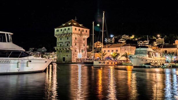 A marina with boats docked, a prominent tower, and buildings in the background. - Luxury villa with heated pool, Marina-Trogir (Pozorac, Marina)