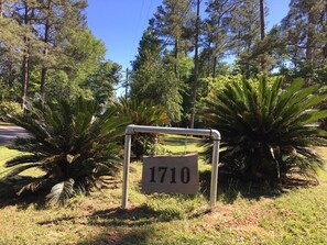 Located near a scenic road, this signpost marks the address 1710.