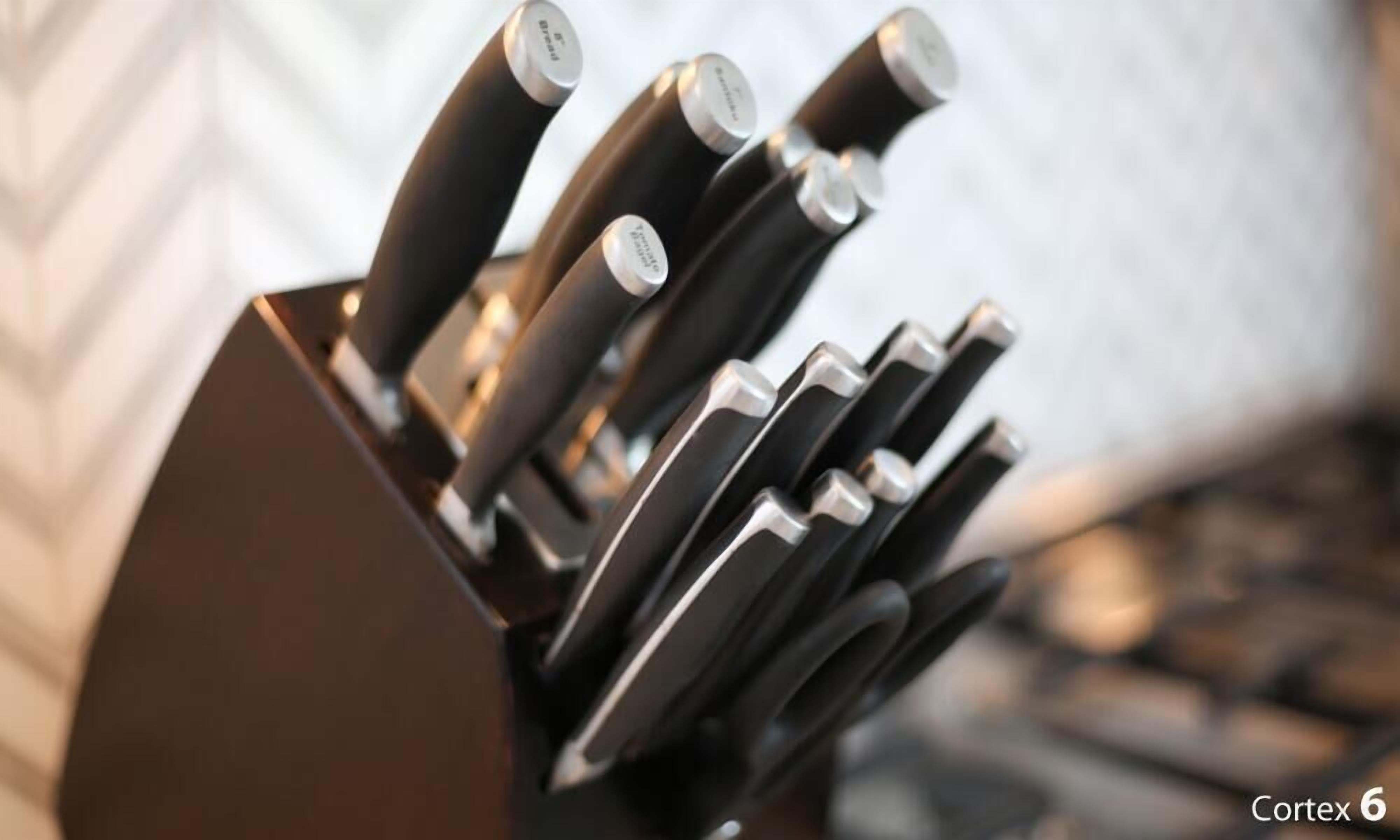 A knife block with several knives.
