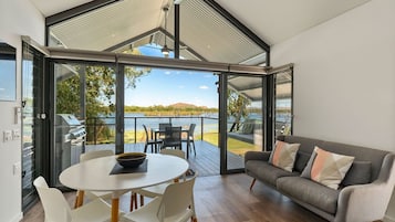 Deluxe Waterfront Cabin | Living area | 43-inch LED TV with digital channels, TV