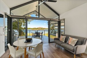 Deluxe Waterfront Cabin | Living area | 43-inch LED TV with digital channels, TV