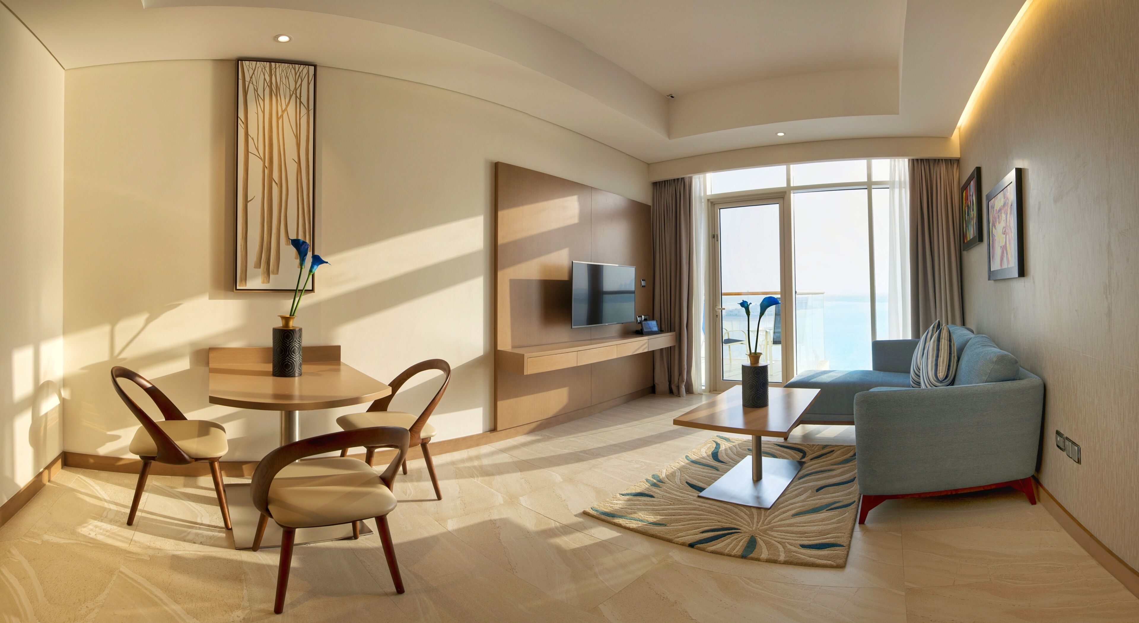 one-bedroom suite with sea view and hotel private beach access | living area | flat-screen tv