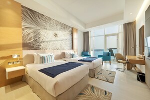 Premium Room with Sea View and Hotel Private Beach Access | Minibar, in-room safe, desk, laptop workspace