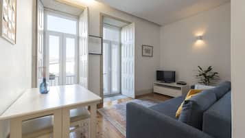 Standard Apartment, 1 Bedroom, Balcony | Living area | Flat-screen TV