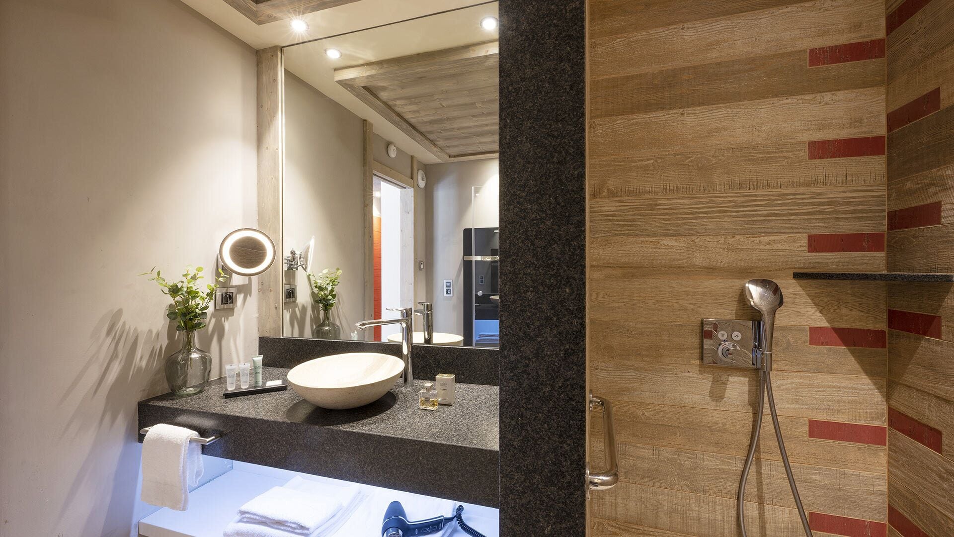 junior suite | bathroom | shower, hair dryer, slippers, towels