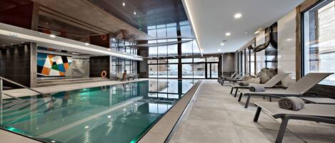 Indoor pool, open 10 AM to 8 PM, pool loungers