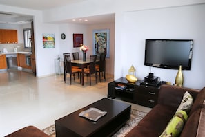 Luxury Apartment, 3 Bedrooms | Living room | Flat-screen TV