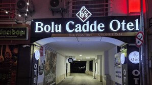 The entrance to Bolu Cadde Otel with a sign indicating the name and contact number. - Bolu Cadde Otel (Bolu)