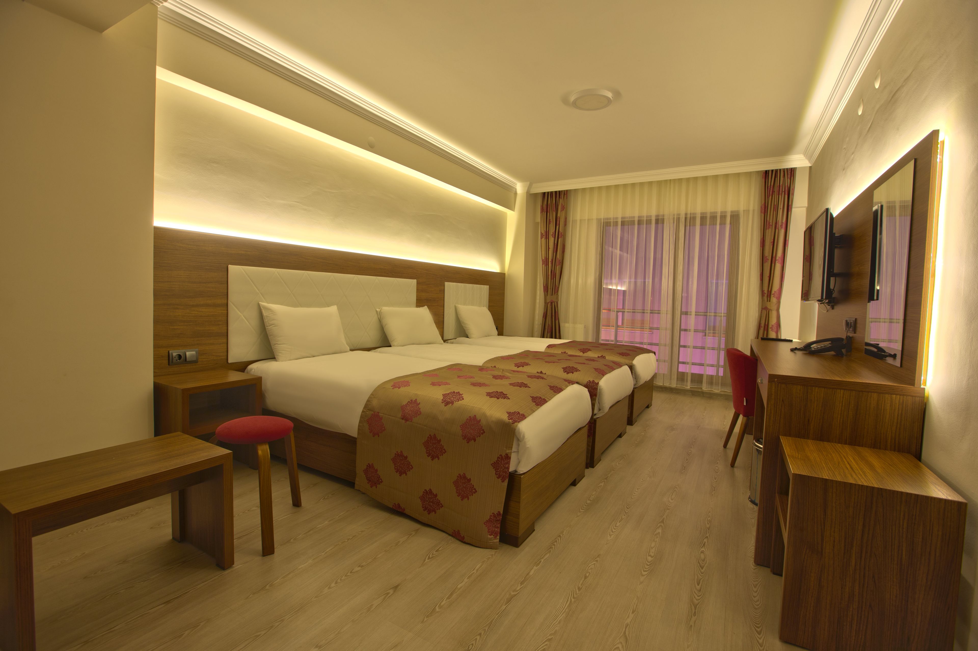 business triple room | minibar, in-room safe, desk, blackout curtains