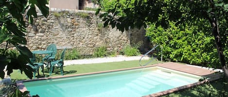 Seasonal outdoor pool, pool loungers