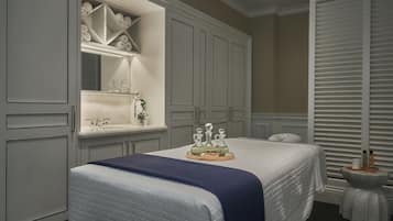 Cozy retreat with a neatly made bed, large wardrobe, and a vanity with sink.