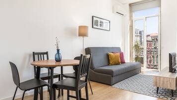 Standard Studio, 1 Bedroom, Balcony, City View | Living area | Flat-screen TV