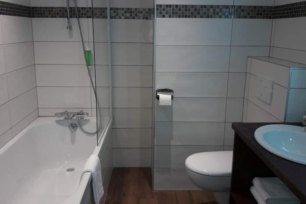 deep-soaking bathtub, free toiletries, hair dryer, bathrobes