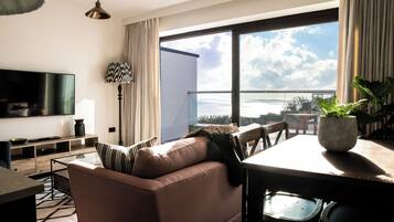 Junior Suite with balcony | Living area | Flat-screen TV