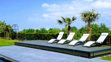 Outdoor pool, sun loungers