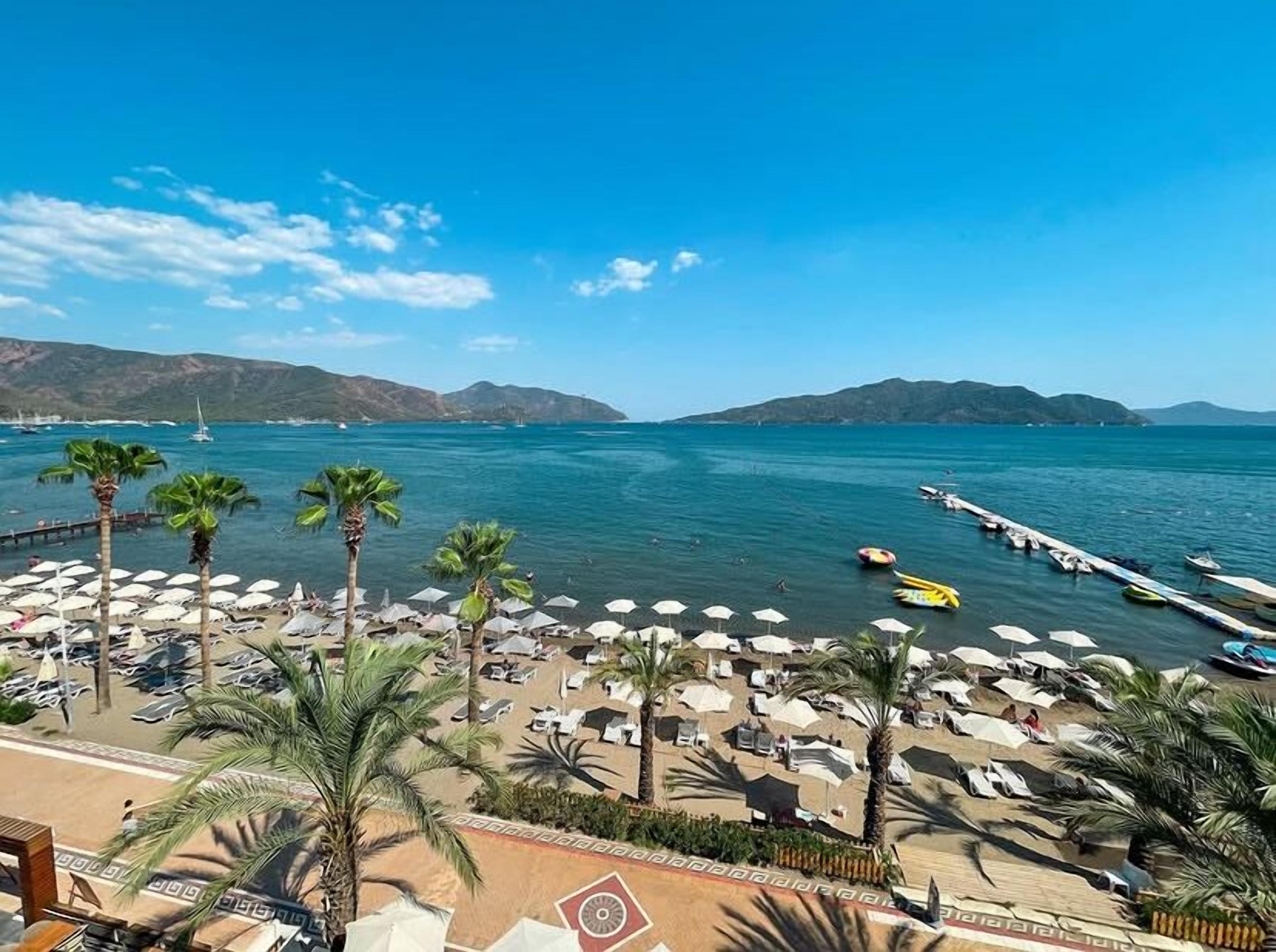 private beach, sun-loungers, beach umbrellas