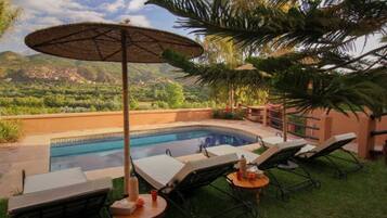 Outdoor pool, pool umbrellas, pool loungers
