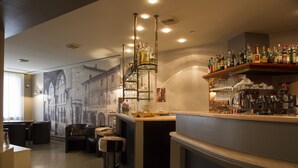 A bar area with a mural of a building, bar stools, and shelves of liquor bottles. - Hotel Europa (Viadana)