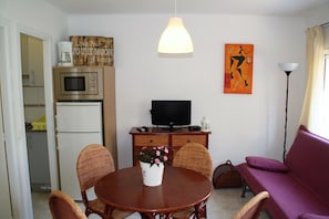 Apartment, 2 Bedrooms, Ground Floor (Canada 11) | Living area | Flat-screen TV