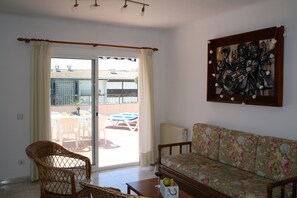 Apartment, 2 Bedrooms (Ocean 30 ) | Living room | Flat-screen TV