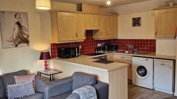 Standard Apartment, 2 Bedrooms | Living area | Flat-screen TV