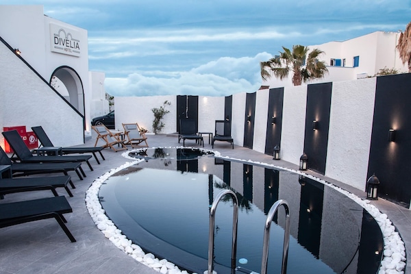 Outdoor pool, open 10:00 AM to 8:00 PM, pool umbrellas, sun loungers