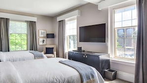 A hotel room with two beds, a desk with a TV, and large windows. - The Sire Hotel Lexington,tapestry Collection by Hi (Lexington)