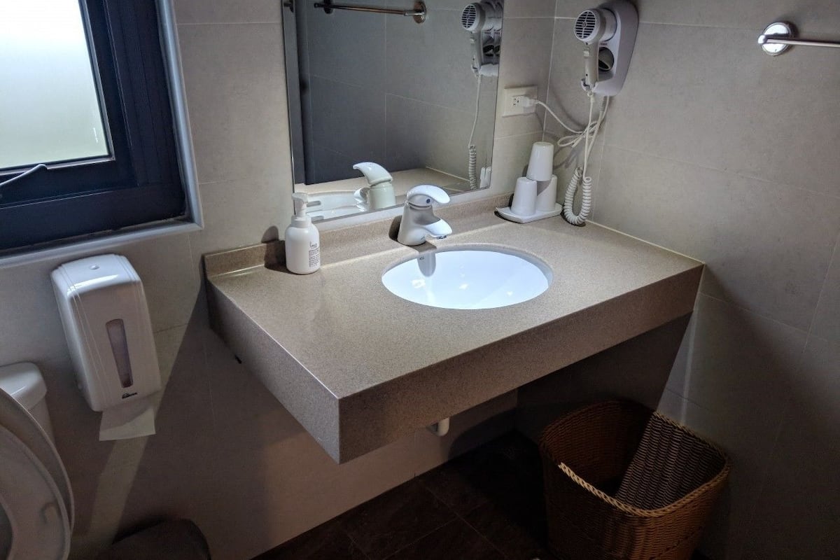 deluxe triple room, 3 single beds, garden view | bathroom | shower, hair dryer, slippers, towels