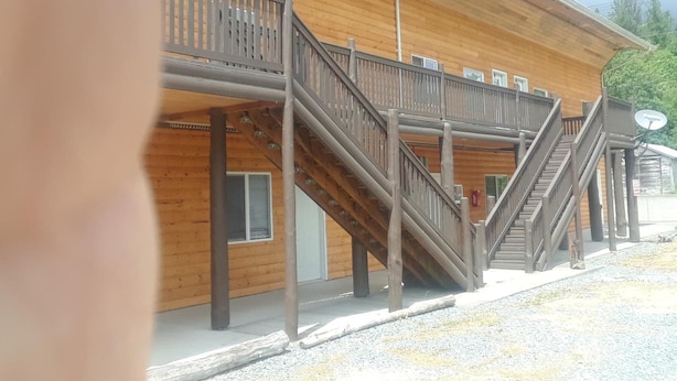 A wooden building with a balcony and a staircase. - Mt. Baker Hotel (Concrete)