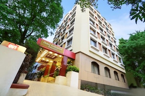 A hotel entrance with a sign reading 'Hotel Kohinor Executive.' - Kohinoor Executive (Pune)