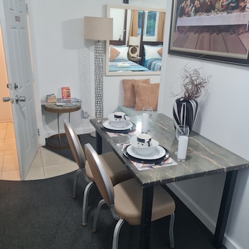 Executive Double Room, 2 Double Beds | In-room dining at Bell At The Airport Suites - Adults Only