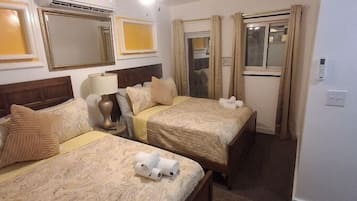 Executive Suite, 2 Double Beds, Pool View | Minibar, desk, laptop workspace, iron/ironing board