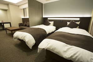 Suite Familiale, plusieurs lits, non-fumeurs | Couette en duvet d'oie, espace de travail pour ordinateur portable