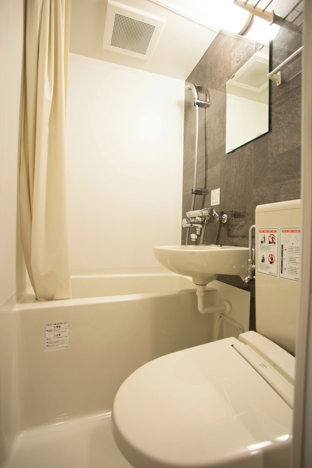 basic twin room | bathroom | free toiletries, hair dryer, bathrobes, slippers