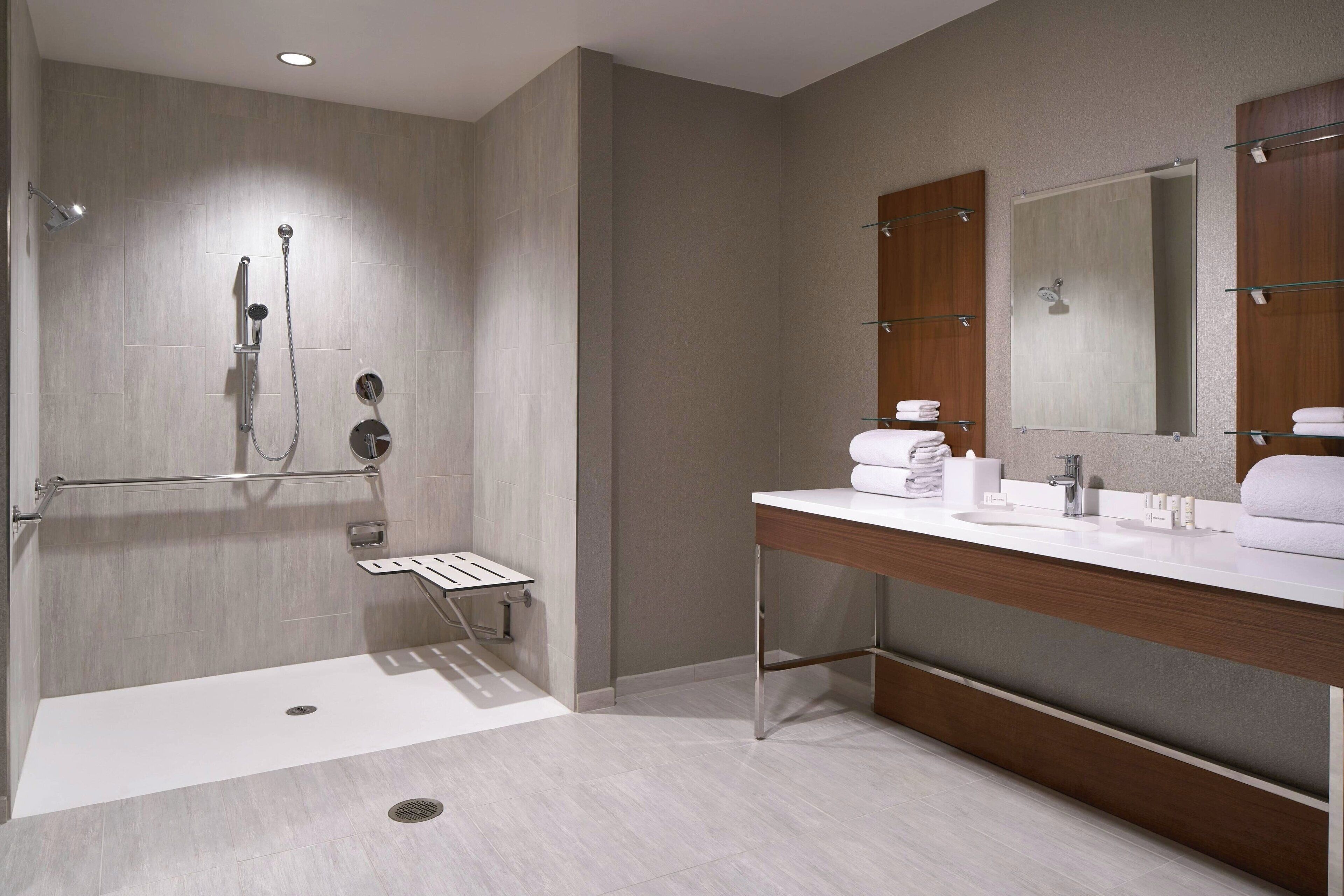 studio, 1 king bed with sofa bed, non smoking, corner (mobility accessible, roll-in shower) | bathroom | free toiletries, hair dryer, towels, soap