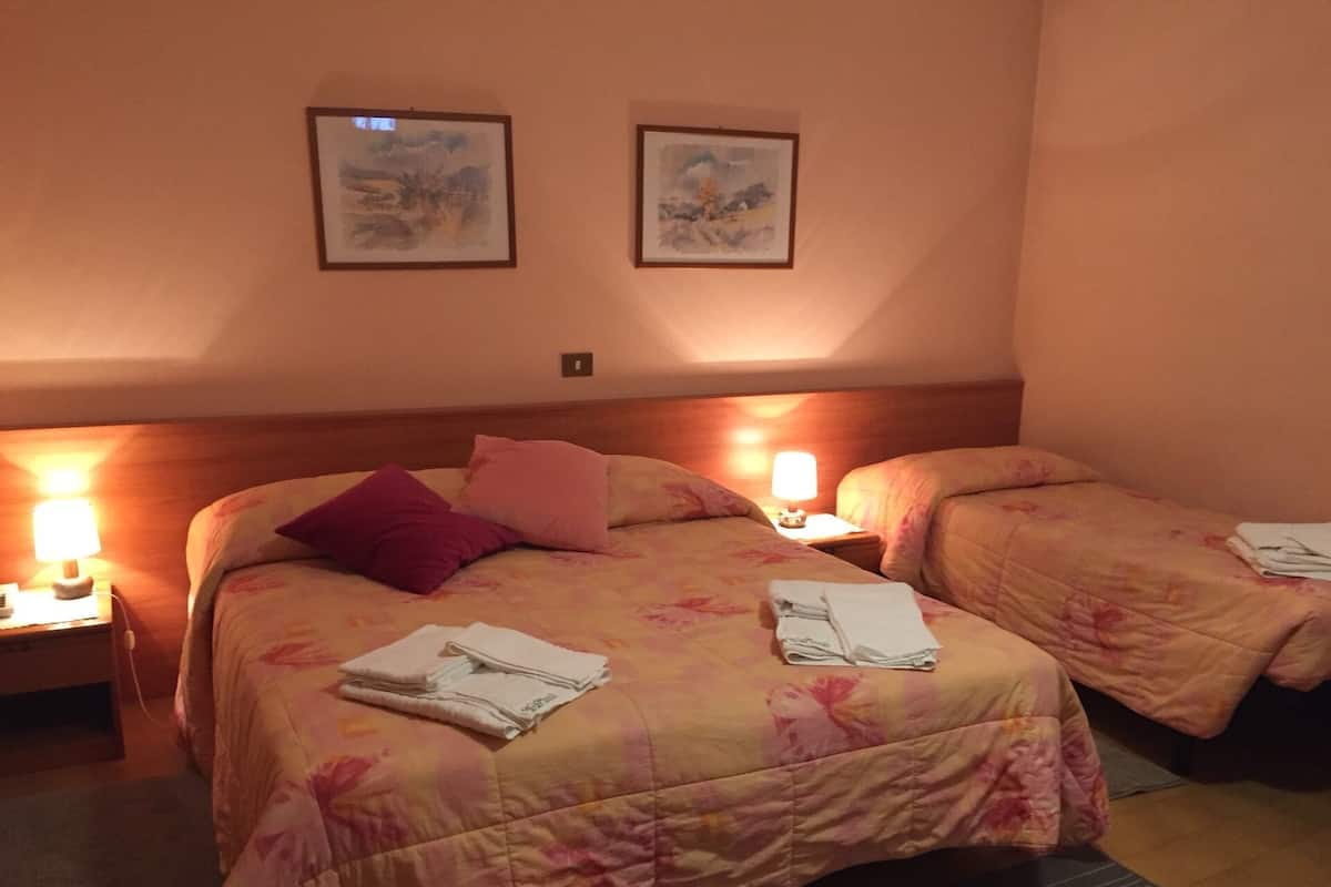 Economy Quadruple Room | In-room safe, desk, free WiFi, bed sheets